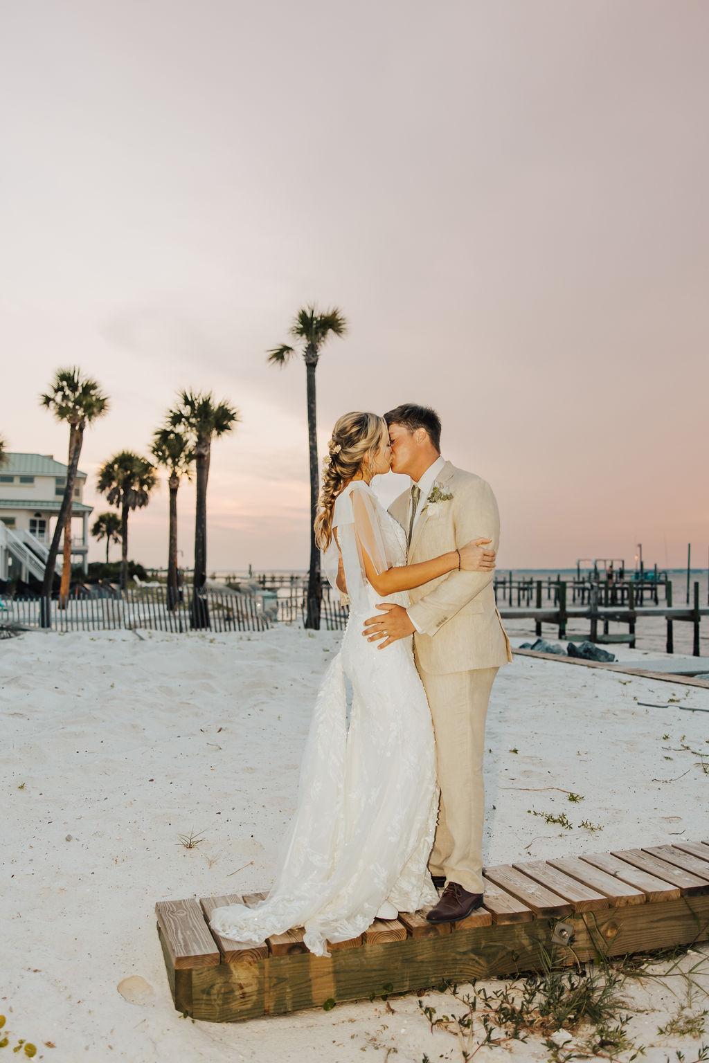 Gorgeous sunset beach wedding photo with couple. Full service Wedding Planning for destination bride.